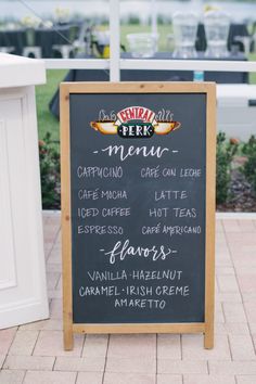 a menu board sitting on the side of a sidewalk