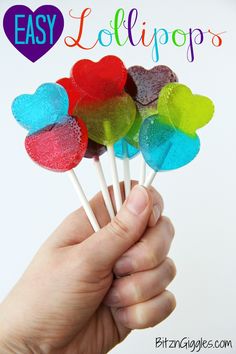 a hand holding lollipops with the words easy lollipops on them