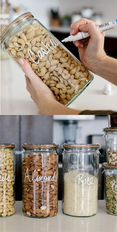 a person holding a jar filled with nuts and rice next to other jars full of peanuts