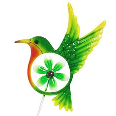 a green and orange bird shaped lollipop with water droplets on it's wings