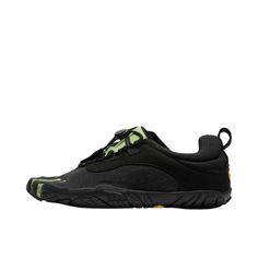 a black and green sneaker with yellow laces