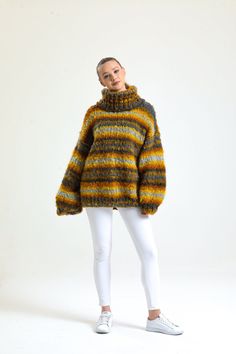 Introducing our newest addition to the wardrobe essentials: the Handmade Mustard Turtleneck Sweater Perfect for the chilly weather, this chunky and oversized jumper is designed for keep you warm and cozy all day long. The classic striped pattern adds a touch of style to this comfortable pullover. Made with high-quality knit material, this sweater for women is perfect for layering or wearing on its own. Upgrade your winter wardrobe with our Turtleneck Sweater and experience ultimate comfort and style. Order now and stay warm in this winter! Chunky Knit Cardigan Size Guide : Country/Size ... S/M  M/L  L/XL USA & CAN : .... 2 - 6  6 - 10  10 - 14 EU :  34-38 .... 38-42  42-46 UK & AUS :  6-10  10-14  14-18 Material: Premium acrylic wool blend extra soft yarn Cleaning: Machine washable at 30 d Oversized Multicolor Wool Sweater, Oversized Yellow Sweater For Winter, Multicolor Wool Sweater, Oversized Yellow Chunky Knit Sweater, Oversized Cozy Yellow Sweater, Yellow Oversized Cozy Sweater, Oversized Yellow Cozy Sweater, Cozy Oversized Yellow Sweater, Mustard Turtleneck