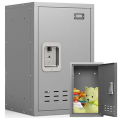 an open safe with a stuffed animal in it's door and another one behind it