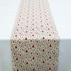 a red and white table cloth with trees on it