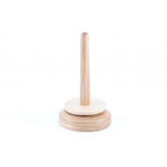 a wooden stand with a white base and wood dows on it's sides