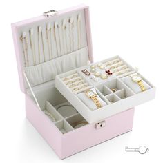 a pink jewelry box filled with lots of different items