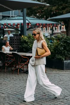 The Best Street Style At Copenhagen Fashion Week SS22 | British Vogue Street Style Chic Summer, Casual Fashion Show Outfit, Spring Summer Style 2023, Copenhagen Fashion Week Street Style, Copenhagen Street Style, Reportage Photography, Trousers White, Scandinavian Fashion, Copenhagen Fashion