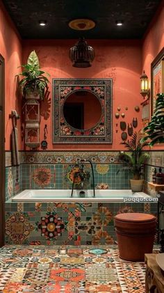 the bathroom is decorated with colorful tiles and potted plants on the wall, along with a large mirror above the bathtub