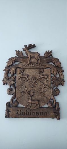 a wooden plaque with an animal on it