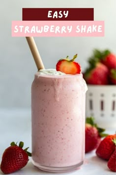 strawberry milkshake in a glass with strawberries on the side and text overlay