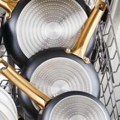 pots and pans are stacked in the dishwasher