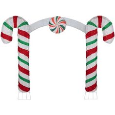 two candy canes are attached to an arch