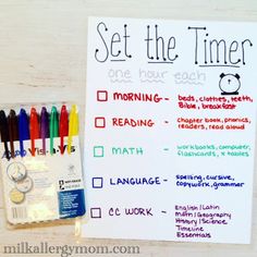 a set the time poster with markers and pencils next to it on a table