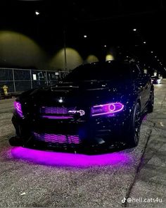 a black car with purple lights on it