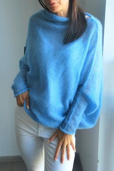 "Light jeans blue soft mohair cardigan, mohair silk poncho, blue soft mohair pullover, light blue mohair shawl, jeans blue mohair sweater So comfy, fuss free and great for layering. Balance the dramatic draping with leggings or your favourite skinny jeans. Go for a casual, lived in feel or dress it up for a dramatic evening look, depending on your mood. Can be worn open or belted. Will work well for maternity wear as well. Light weight jersey knit. Content + Care - 75% mohair, 25 % silk - Hand w Silk Poncho, Mohair Shawl, Wedding Sweater, Purple Cardigan, Light Jeans, Mohair Cardigan, Soft Cardigan, Beige Cardigan, Blue Soft