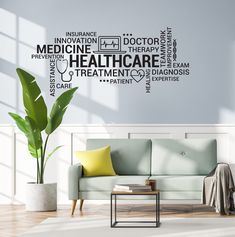 a living room with a couch, coffee table and potted plant on the floor