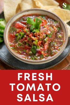 fresh tomato salsa in a bowl with tortilla chips on the side and text overlay