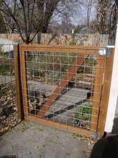 a wooden gate with metal bars on it