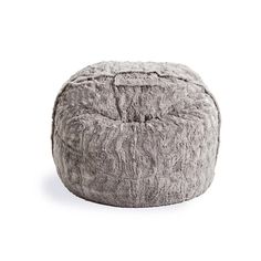 a large grey bean bag sitting on top of a white floor