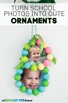 an ornament hanging from the side of a wall with two pictures on it