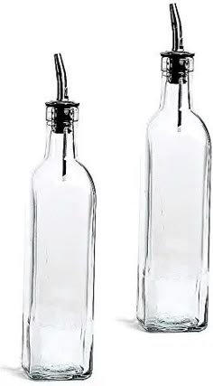 two clear glass bottles with black lids and metal spigots on the top one is empty