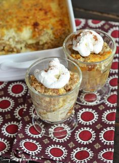 two desserts are sitting on a red and white place mat next to a casserole dish