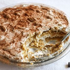 there is a dessert in the glass dish with a fork sticking out of it's side