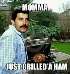 a man with a mustache is grilling a turkey