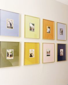 a wall with many different colored frames on it