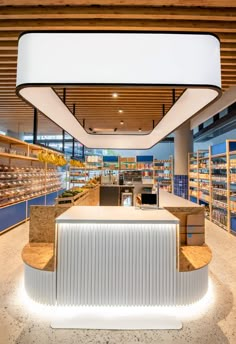 the inside of a store with shelves and counters