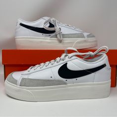 Elevate Your Sneaker Game With These Nike W Blazer Low Platform Sneakers In White, Black, Sail, And Orange. The Shoes Feature A Low Top Shoe Shaft Style With A Lace-Up Closure And Are Made With High-Quality Leather For A Comfortable Fit. The Nike Blazer Low Platform Model Is Perfect For Athletic Wear And Casual Occasions. These Sneakers Come In A Uk Size 6 And A Us Size 8 With A Standard Shoe Width. The Shoes Are Designed With A 70s And 80s Retro Theme, Making Them Perfect For Athleisure Fashion. The Sneaker's Features Include A Cushioned Sole, Limited Edition Design, And Adjustable Fit. Ideal For Walking, School, And Basketball Activities, These Nike Blazer Low Platform Sneakers Are A Mus Basketball Activities, Nike Blazer Low, Orange Sneakers, Blazer Low, Retro Theme, Sneaker Games, Athleisure Fashion, Nike Blazer, 80s Retro