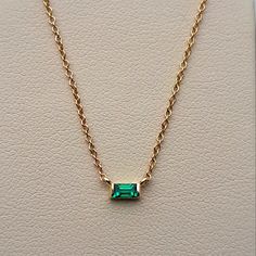 An Absolutely Chic Natural Emerald Solitaire Pendant. It's A Medium-Green, The Perfect Emerald Shade! No Inclusions And Sparkly! This Is A Lively Emerald, Which Is Pretty Difficult To Find In The Baguette Cut. Channel Set Into 14 Karat Yellow Gold. This Necklace Is Adjustable By 3 Sizes! Ranging Between 16 Inches And 18 Inches, Making It Perfect To Wear By Itself Or For Layering Necklaces. (Which Is Very In Style Right Now!) Packaged With A Luxury Gift Box And Complimentary Travel Pouch And Poli Emerald Cut Emerald Necklace, Gold Emerald Necklace With Baguette Cut For Gift, Fine Jewelry With Baguette Gemstones, Yellow Gold Baguette Gemstone Jewelry, Baguette-shaped Yellow Gold Jewelry As A Gift, Baguette Cut Emerald Necklace Gift, Gift Fine Jewelry Emerald Necklace With Baguette Diamonds, Fine Jewelry In 14k Gold With Baguette Shape, Fine Jewelry 14k Gold Baguette