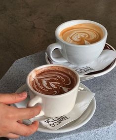 two cups of hot chocolate on top of each other