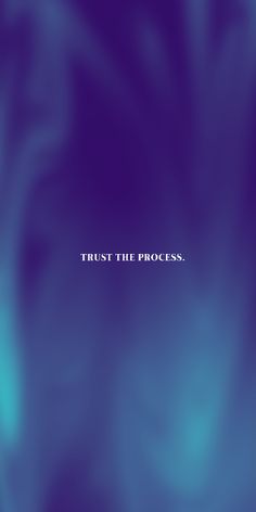 a blurry blue background with the words trust the process