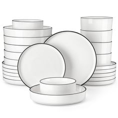 a stack of white plates and cups sitting next to each other