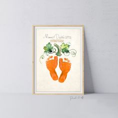 an orange pair of feet with green leaves on them and the words, mom's daydream - lite