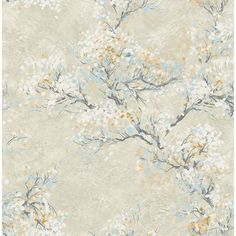 a blue and gray wallpaper with white flowers on the branches in front of it