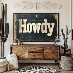 a wooden sign that says hovdy on the wall above a dresser with cactus and cacti