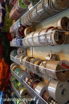 the shelves are filled with many different types of spools