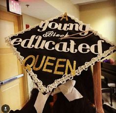 a woman wearing a graduation cap with the words young black educated queen written on it