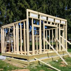 a house being built in the middle of some grass