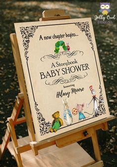 a wooden easel with a sign on it that says a storybook baby shower