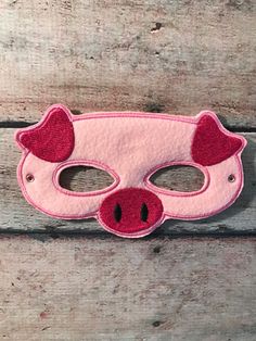 Kids felt pig mask that's great for any occasion. Perfect for the days your child wants to pretend play or dress-up. This kids mask can be used by both boys and girls.  This animal mask has an elastic around the back for easy on and off. Made with soft, eco friendly felt. Will fit from toddler to about 10 years old.  Your child will have hours of fun, imaginary play with this handmade pig mask. This felt mask is perfect for trick-or-treating or everyday pretend play. All my masks are made with t Felt Pretend Play, Pig Mask, Pig Costumes, Animal Mask, Felt Mask, Imaginary Play, Kids Mask, Animal Masks, Mask For Kids