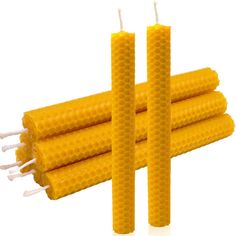 three beeswap candles sitting on top of each other