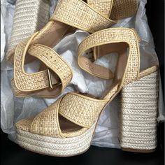 Make A Fabulous Statement By Donning The Gorgeous And Comfortable Design Of The Coach Nelly Raffia Sandals. Measurements: Heel Height: 5 In Weight: 1 Lb 1 Oz Platform Height: 1 12 In Chic Brown Straw Sandals, Beige Straw High Heels, Chic Straw High Heel Sandals, Straw Ankle Strap Heels For Spring, Beige Open Heel Heels For Vacation, Beige High Heels For Vacation, Coach Sandals With Ankle Strap And Removable Insole, Straw Sandals With Stacked Heel And Round Toe, Natural Sandals With Stacked Heel And Round Toe