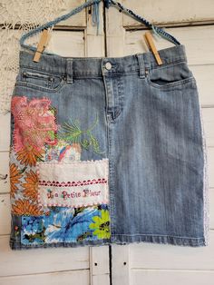 Women's size 8 denim skirt.  Uniquely upcycled using vintage fabrics, linens and trims.  All embellishments, including stitching and embroidery are sewn by hand.  In honor of St. Therese of Lisieux, also call The Little Flower.  St. Therese was a French Catholic Discalced Carmelite nun who is widely venerated today around the world.  She is the patron of missions and of florists. Medium Wash Cotton Skirt With Patchwork, Cotton Skirt With Patchwork In Medium Wash, Bohemian Denim Skirt With Patchwork Details, Bohemian Denim Skirt With Patchwork, Embroidered Medium Wash Denim Skirt, Bohemian Denim Patchwork Skirt, Upcycled Cotton Denim Skirt For Summer, Upcycled Blue Denim Skirt For Spring, Spring Cotton Skirt Upcycled