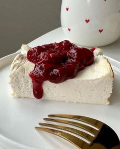 a piece of cheesecake on a plate with a fork