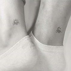 two sun and moon tattoos on the wrist