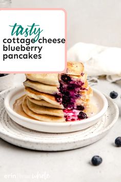 a stack of blueberry pancakes on a plate with the words tasty cottage cheese blueberry pancakes