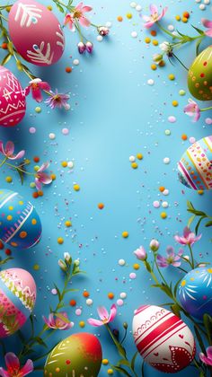 an overhead view of colorful easter eggs and flowers on a blue background with confetti sprinkles